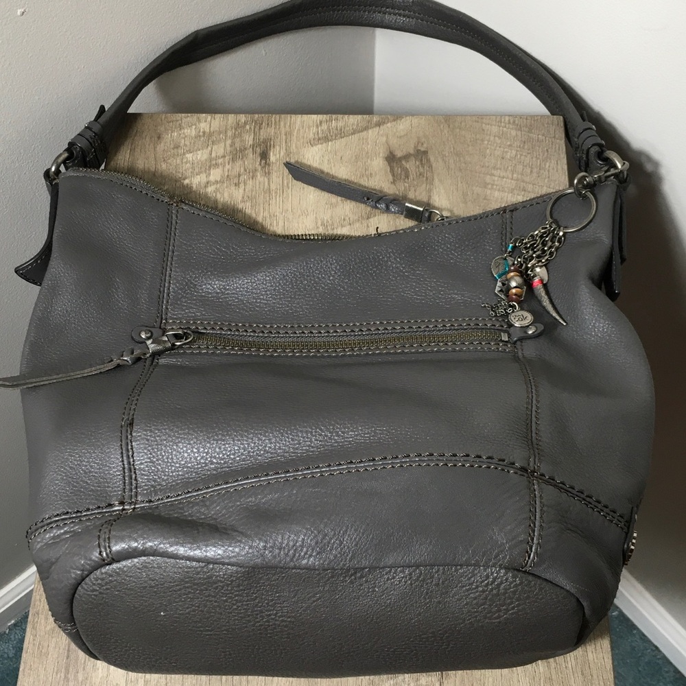 The Sak Gray Pebbled Leather Shoulder Hobo with Charm.